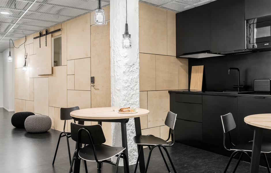 Forenom Hostel Jyväskylä plywood black shared kitchen Designed by Studio Puisto Architects