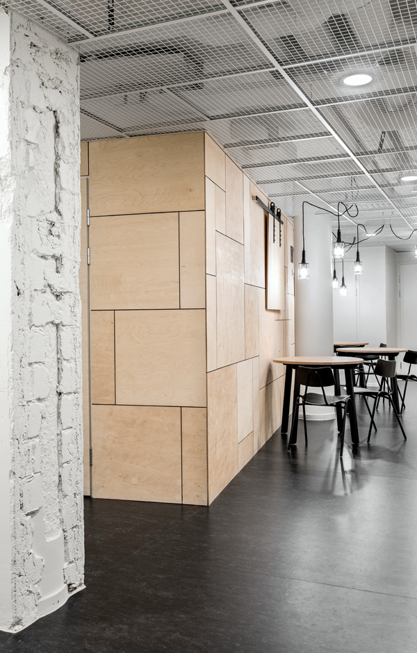 Forenom Hostel Jyväskylä shared kitchen and lounge plywood Designed by Studio Puisto Architects