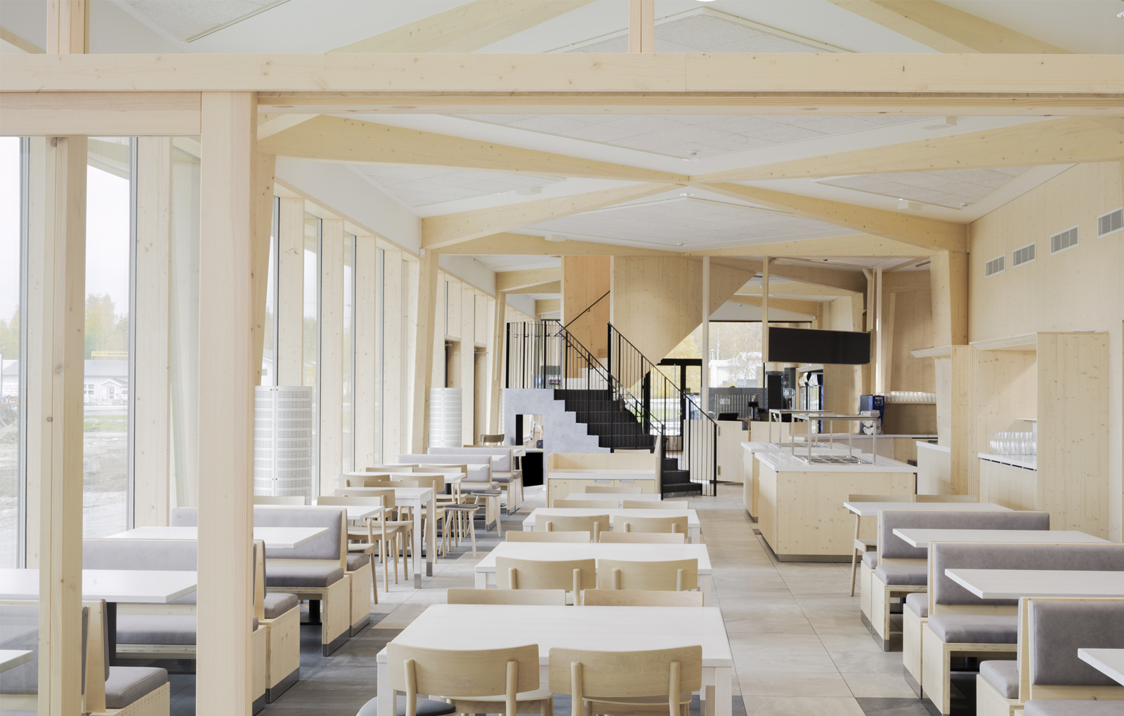 Rest Area Niemenharju main building wooden interior restaurant dining area Designed by Studio Puisto Architects