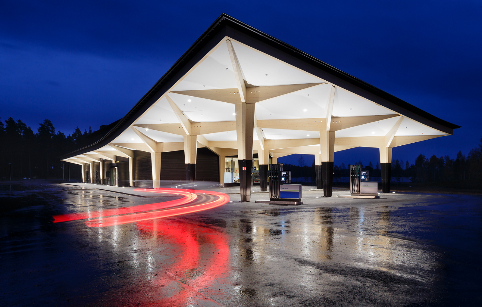 Rest Area Niemenharju fueling area main building canopy with wooden columns Designed by Studio Puisto Architects